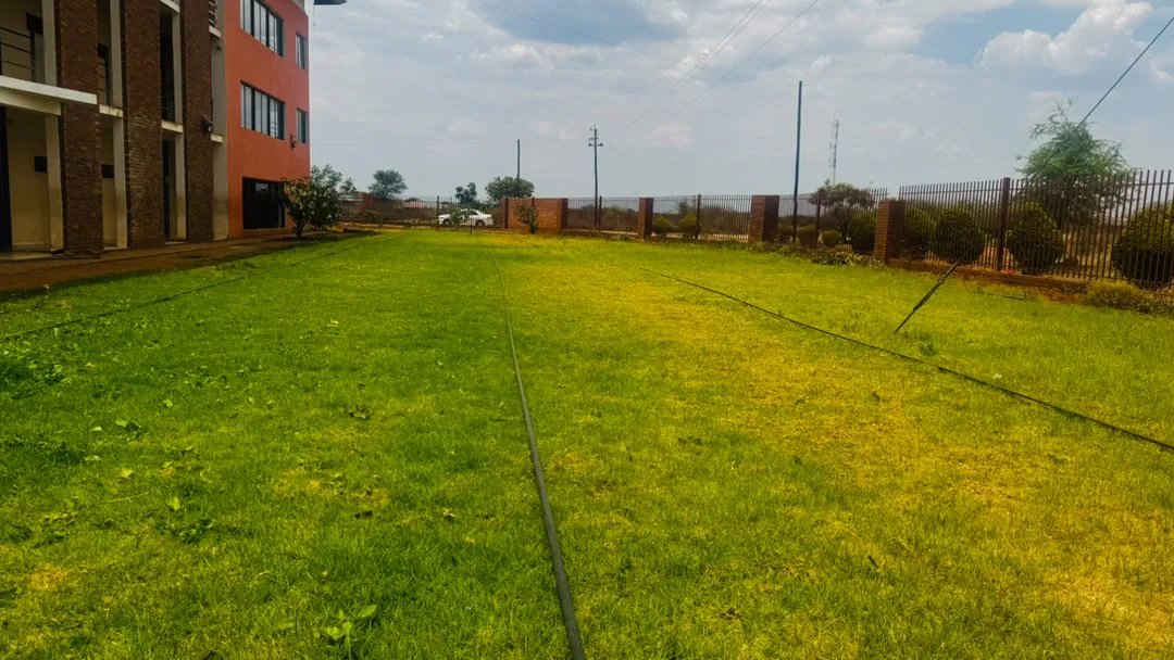 The school grounds beside the classroom block